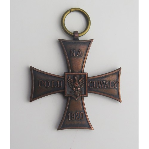 308A - A Polish Cross of Valour medal, impressed no. 50464, lacks ribbon.