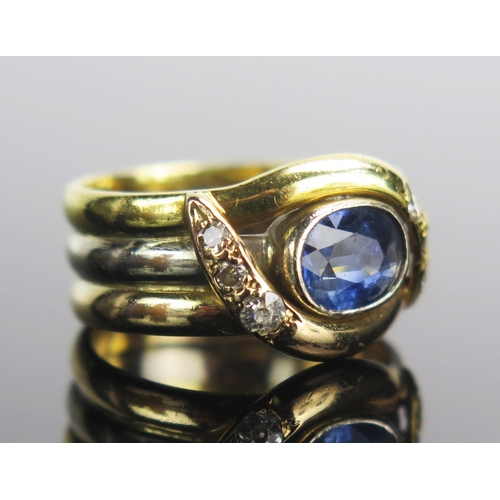 10 - A Sri Lankan Sapphire and Diamond Ring in a Bahrain precious yellow and white gold bespoke made sett... 