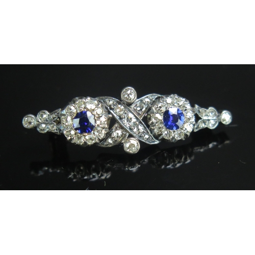 106 - An Antique Dark Blue Spinel and Diamond Brooch in a precious metal setting, 34.8mm, 3.45g