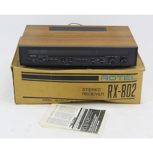 1068 - Rotel RX-802 AM/FM Stereo Receiver, teak cased with original box and owner's manual