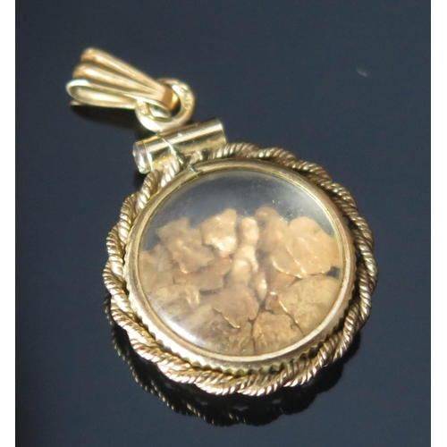 110 - A Gold 'Nugget' Pendant, suspension loop stamped 12KT, 27.2mm drop, 1.99g