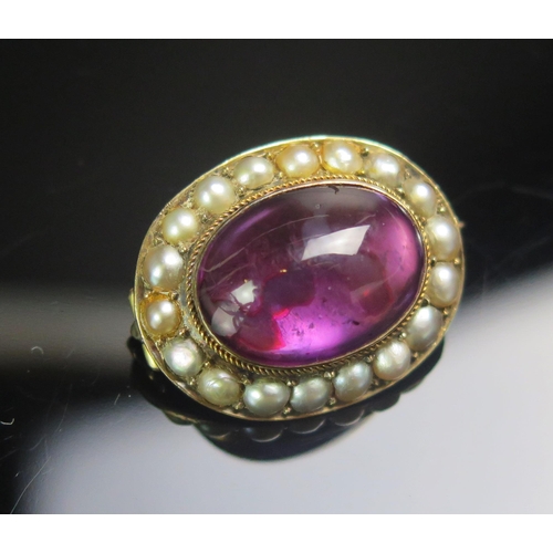 112 - An Antique Cabochon Amethyst and Split Pearl or Cultured Split Pearl Brooch in a precious yellow met... 