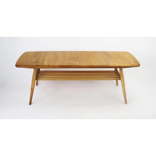 1135 - An Ercol Blonde Coffee Table with ,magazine rack below, 103x44cm