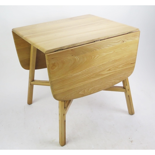 1137 - An Ercol Stripped Oak Kitchen Lap Table, 75(w)x 65-138(l)x72(h)cm