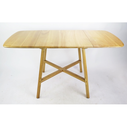 1137 - An Ercol Stripped Oak Kitchen Lap Table, 75(w)x 65-138(l)x72(h)cm