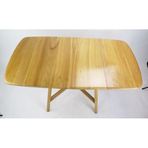 1137 - An Ercol Stripped Oak Kitchen Lap Table, 75(w)x 65-138(l)x72(h)cm