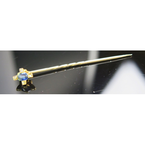 119 - A Sapphire and Diamond Pin in a precious yellow metal setting, 2.03g