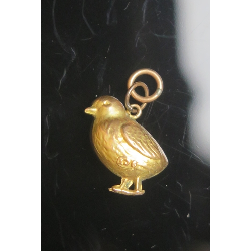 121 - An Antique 9ct Gold Chick Charm, stamped 9CT, .6g