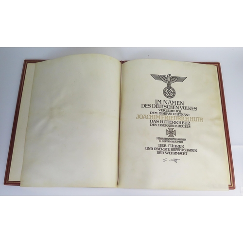 1550 - A scarce Third Reich Knights Cross of the Iron Cross presentation document on vellum to (Oberstleutn... 