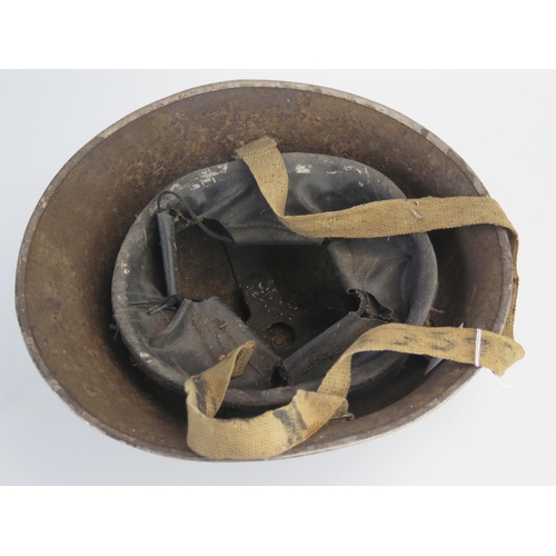 1552 - A British Mk III steel turtle helmet, with leather liner and canvas chin strap.