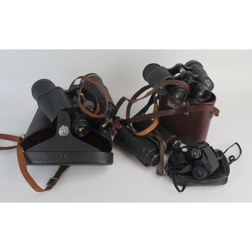 1562 - A pair of Pentax 7 x 50 binoculars contained in a leather carrying case, a pair of 8 x 40 binoculars... 