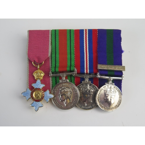 1569 - Group of four miniatures, includes CBE (civil) , defence Medal 1939-45 War Medal and GSM with Palest... 