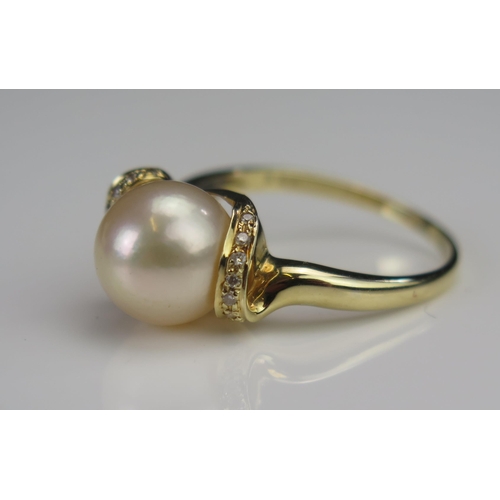 168 - A 14ct Gold, Cultured Pearl and Diamond Ring, c. 9.1mm pearl, size N.25, stamped 585 005, 3.37g