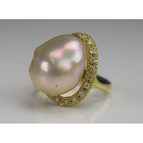 172 - An 18ct Gold, Baroque Pearl or Cultured Pearl and Diamond Ring, 19.5mm head, stamped 18K, .2ct of di... 