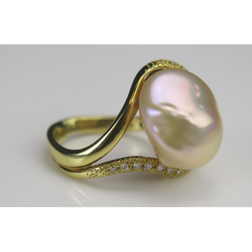 172 - An 18ct Gold, Baroque Pearl or Cultured Pearl and Diamond Ring, 19.5mm head, stamped 18K, .2ct of di... 