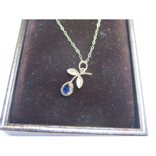 193 - A 9ct Gold and Sapphire Pendant on chain, 18.7mm drop, 9