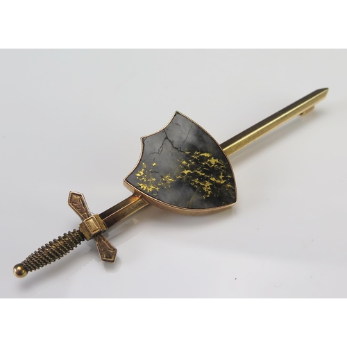 197 - A Goldstone Shield and Sword Precious Yellow Metal Brooch, 85.5mm long, KEE tests as 15ct, 11.68g.  ... 