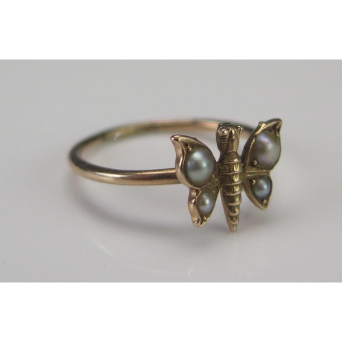 198 - A Precious Yellow Metal and Seed Pearl or Cultured Seed Pearl Butterfly Ring, size M.5, KEE tests as... 