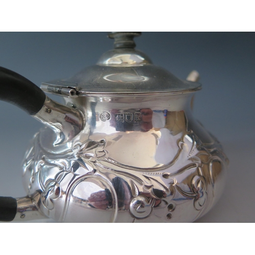 510 - An Edward VII silver teapot, maker Edwin Dunthome, London, 1905, of squat circular form with embosse... 