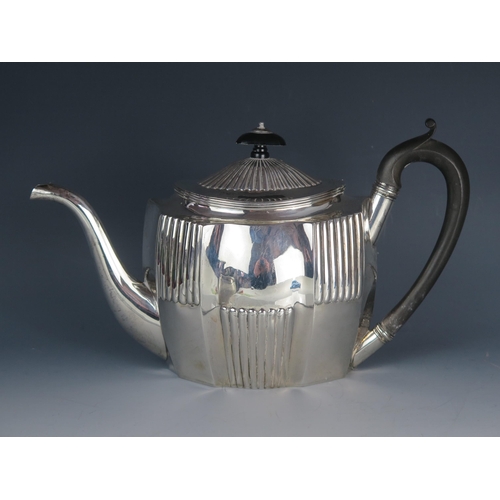 539 - A George III silver teapot, maker Timothy Renou, London, 1802, of oval form, with domed and reeded h... 