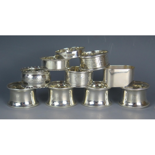 556 - A mixed collection of ten silver napkin rings, various makers and dates, total weight of silver 152g... 