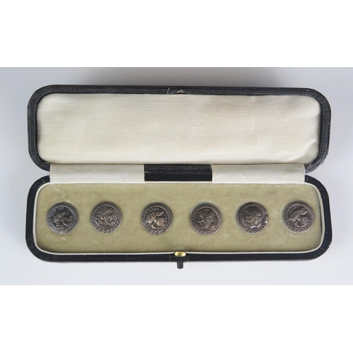 564 - A set of six silver ancient coin style buttons, contained in a fitted, case, 11g