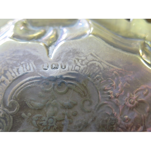 569 - A George III silver waiter, maker's mark worn, London, 1792, with chased foliate and scroll decorati... 