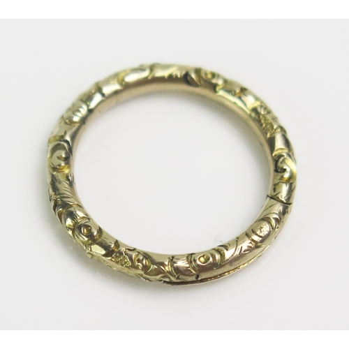 63 - An Antique Precious Yellow Metal Jump Ring with foliate decoration, 18.1mm outer diam., KEE tests as... 