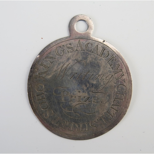 691 - A George III silver prize medal for writing, from Kings Academy, Chapel Street, inscribed and dated ... 