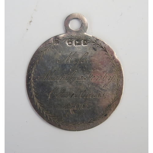 691 - A George III silver prize medal for writing, from Kings Academy, Chapel Street, inscribed and dated ... 