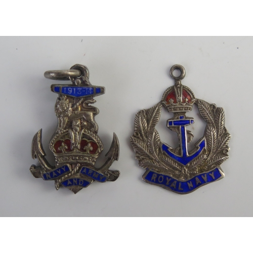 695 - Two silver Royal Navy pendants with fouled anchor and enamel decoration.