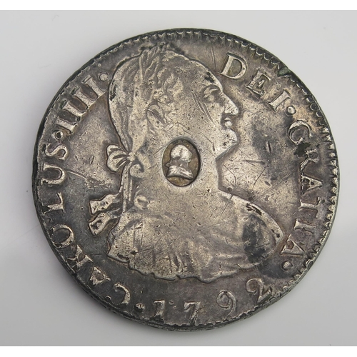 875 - 1792 8 Reales counter stamped dollar