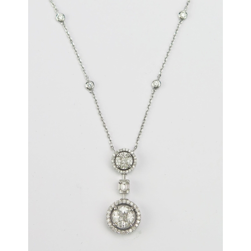 9 - A Middle Eastern 18ct White Gold and Diamond Pendant on integral chain set with brilliant round, pri... 
