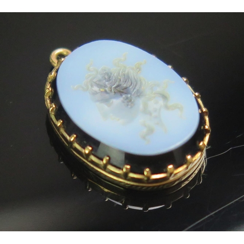 91 - A 9ct Gold and Agate Intaglio Pendant decorated with a female bust in profile, 23.4mm drop, stamped ... 