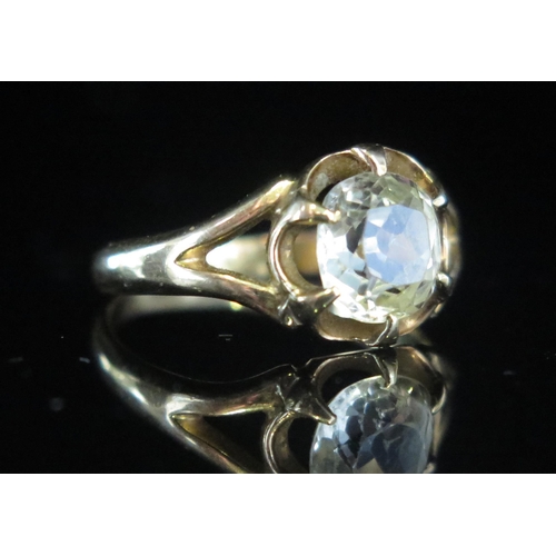 97 - An Antique Old Cut White Sapphire Solitaire Ring in a precious yellow metal setting, 7.4mm stone, si... 