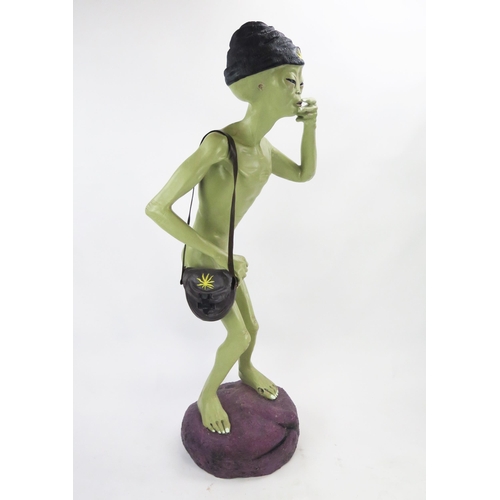 1034 - Life Size Alien Resin Figure with shoulder bag and hat decorated with yellow hemp, figures held to m... 