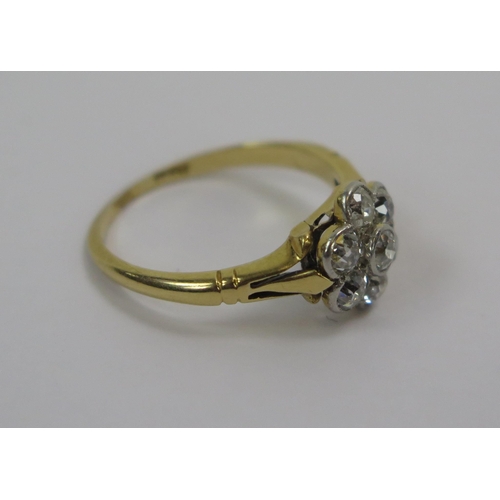 53 - An Antique 18ct Gold and Diamond 'Daisy' Cluster Ring, c.2.8mm old cut millegrain set stone, size K.... 