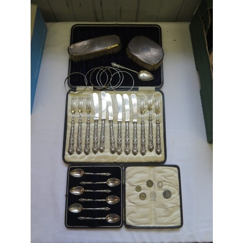 709 - A mixed selection of silver and plated ware including a cased silver handled fruit set, two silver b... 