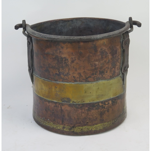 1292 - A 19th century brass and copper log bin of cylindrical form, with steel loop handle, 35cm high, 36cm... 