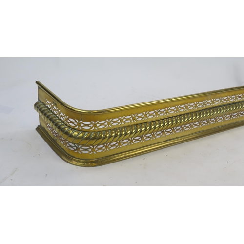 1297 - A 19th century brass fire kerb of rectangular outline, with pierced banded and rope twist decoration... 