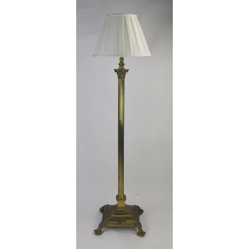 1594 - A brass telescopic Corinthian column standard lamp, with reeded column on a square base with talon a... 