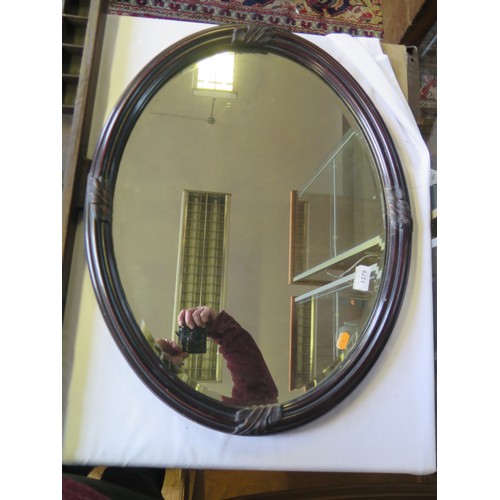 1624A - An oval framed wall mirror, 53cm x 68cm