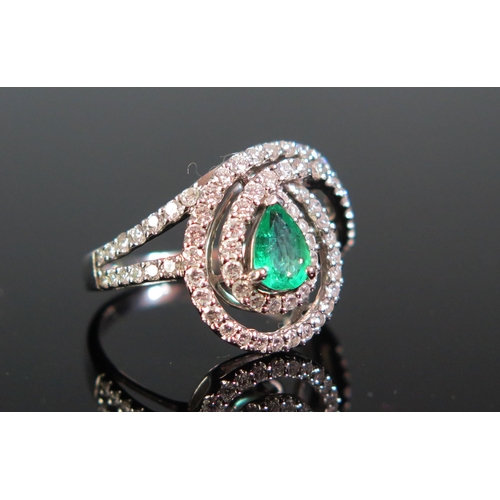 109 - An 18ct White Gold, Emerald and Diamond Ring, c. 6.6x4.7mm principal stone, stamped 750, 5.22g