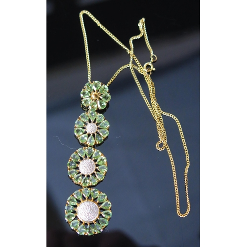 111 - A 9ct Gold, Diamond and Precious Green Stone Pendant on chain, 76.4mm drop, 22.4mm diam. lower 'flow... 