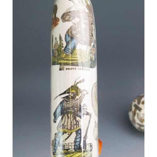 1116 - Two clear glass and decoupage decorated rolling pins, 36cm long together with a matching ball. (3).