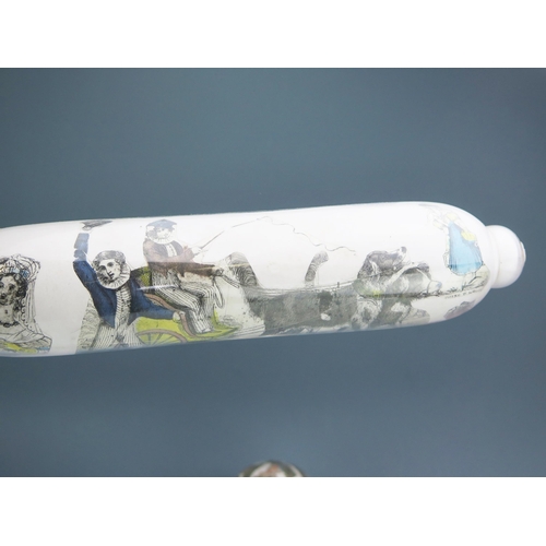 1116 - Two clear glass and decoupage decorated rolling pins, 36cm long together with a matching ball. (3).