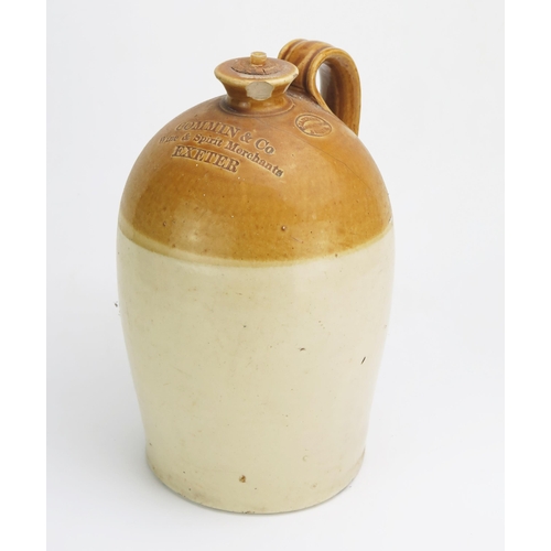 1133 - Commin & Co, Wine & Spirit Merchants, Exeter, stone ware flagon, 31cm high.