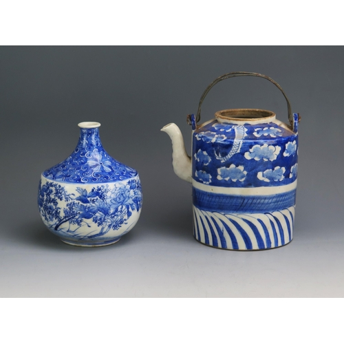 1139 - A Chinese blue and white teapot of cylindrical form, lacks cover 15cm high, together with together w... 