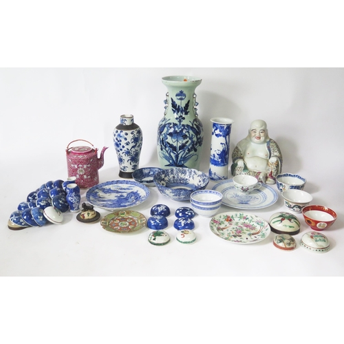 1141 - A Chinese blue and white sleeve vase, 26cm high, a figure of a seated laughing Buddha, various vases... 