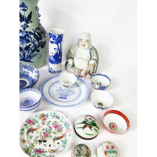 1141 - A Chinese blue and white sleeve vase, 26cm high, a figure of a seated laughing Buddha, various vases... 